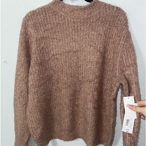 Never worn sweater. New with tags